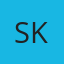 S K