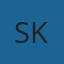 S K
