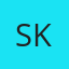 S K