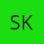 S K