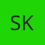 S K