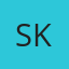 S K
