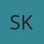 S K