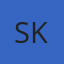 S K