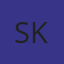 S K