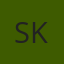 S K