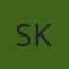 S K