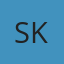 S K