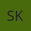 S K