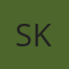S K