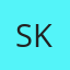 S K