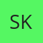 S K