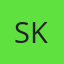 S K