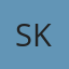 S K