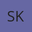 S K