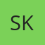 S K