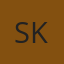 S K