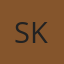 S K