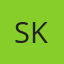 S K