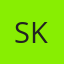 S K