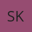S K