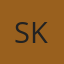 S K