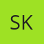 S K