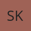 S K