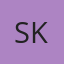S K