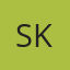 S K