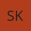 S K