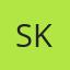 S K