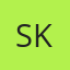 S K