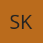 S K