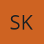 S K