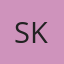 S K