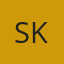 S K