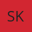 S K