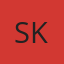S K