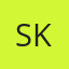 S K
