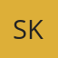 S K