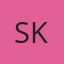 S K