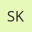 S K