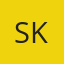 S K