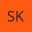 S K